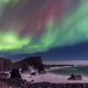 Illustration for article titled Coastal Iceland Is Even More Dramatic Under Dancing Aurora